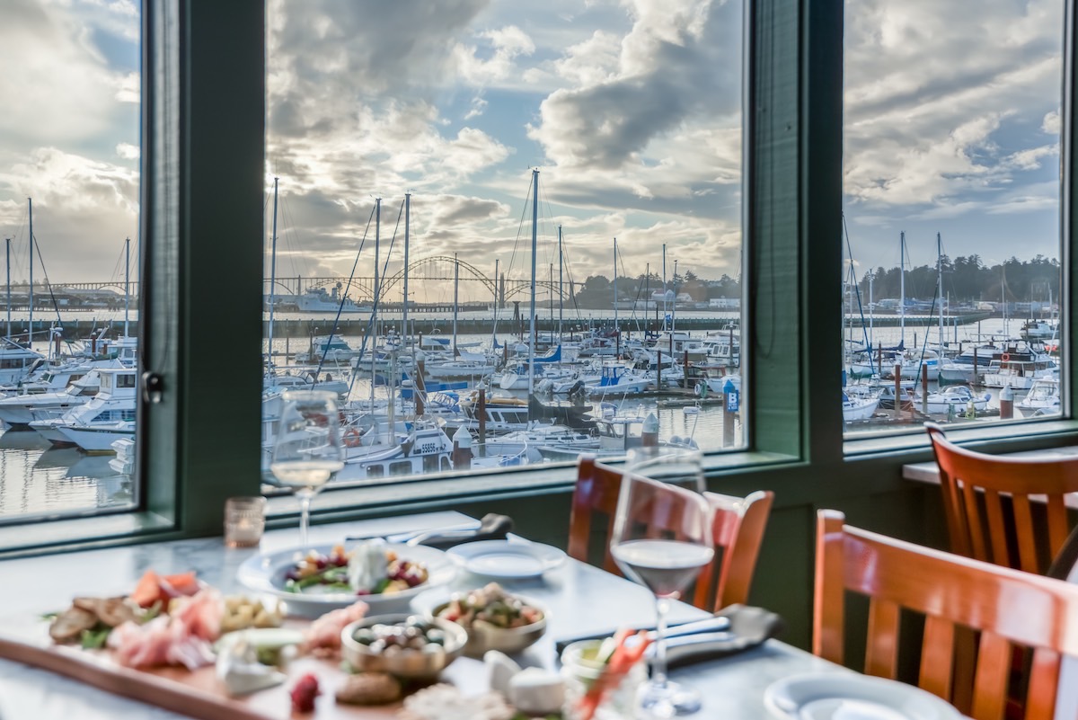 View of marina from the window of Myril with a table full of delicious food